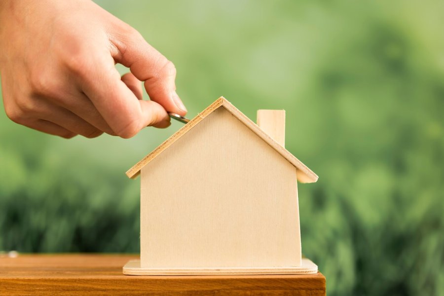 coin-wooden-house-wooden-table